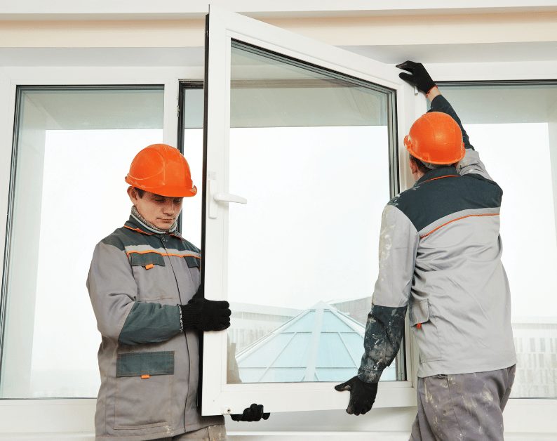 Crew setting a replacement window in a home